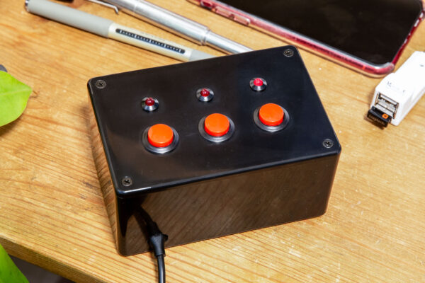 The finished box with three red buttons and three red LEDs.