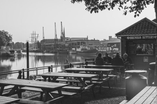 Four men breakfasting at a table at Brunel's Buttery, Bristol