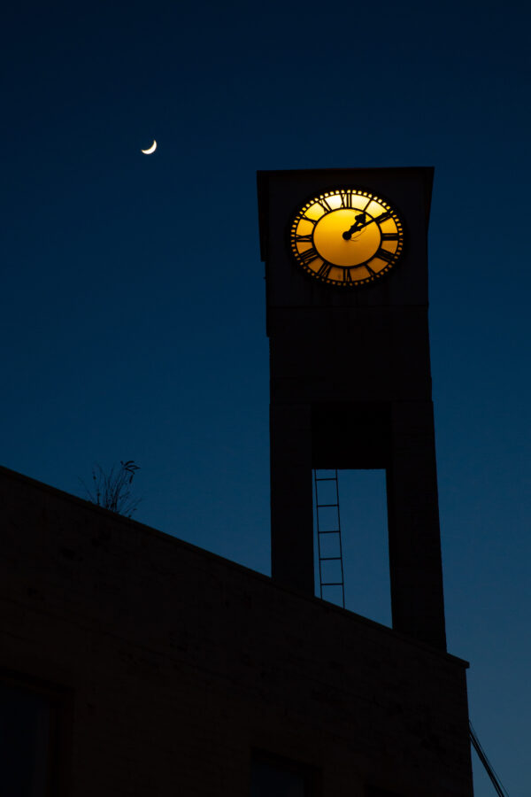 Nighttime scene of the Albion dockyard clock tower on the former offices of Charles Hill